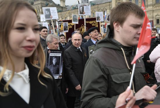 Russian President Vladimir Putin takes part in Immortal Regiment march
