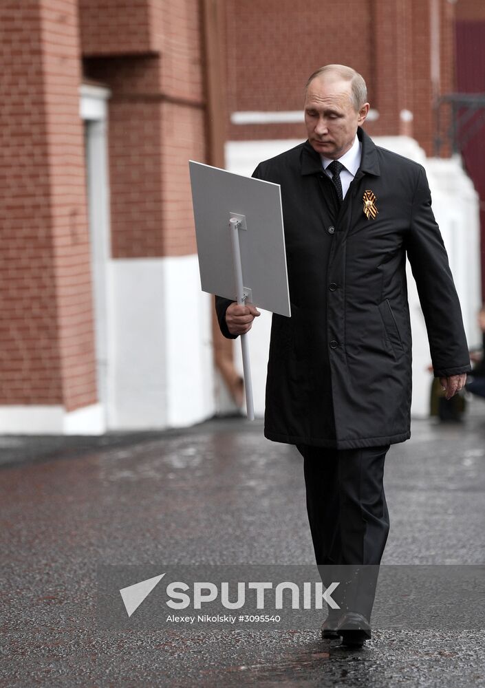 Russian President Vladimir Putin takes part in Immortal Regiment march