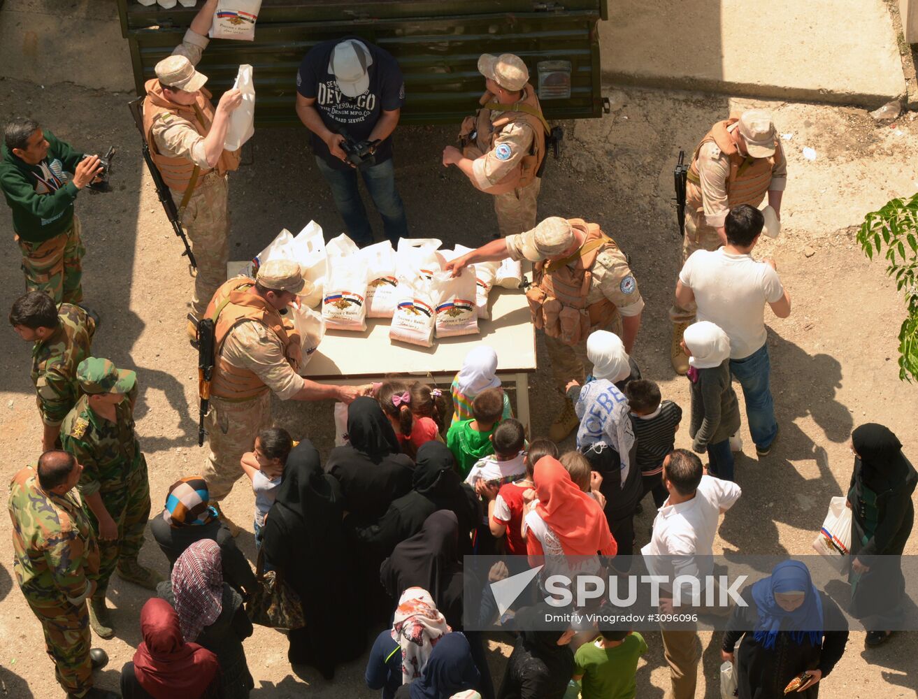 Russian humanitarian aid is distributed at Ras al-Bassit refugee camp