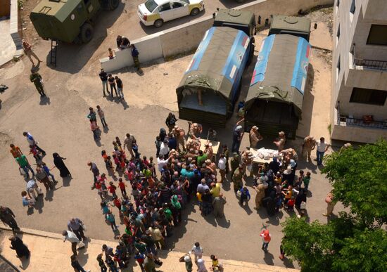 Russian humanitarian aid is distributed at Ras al-Bassit refugee camp
