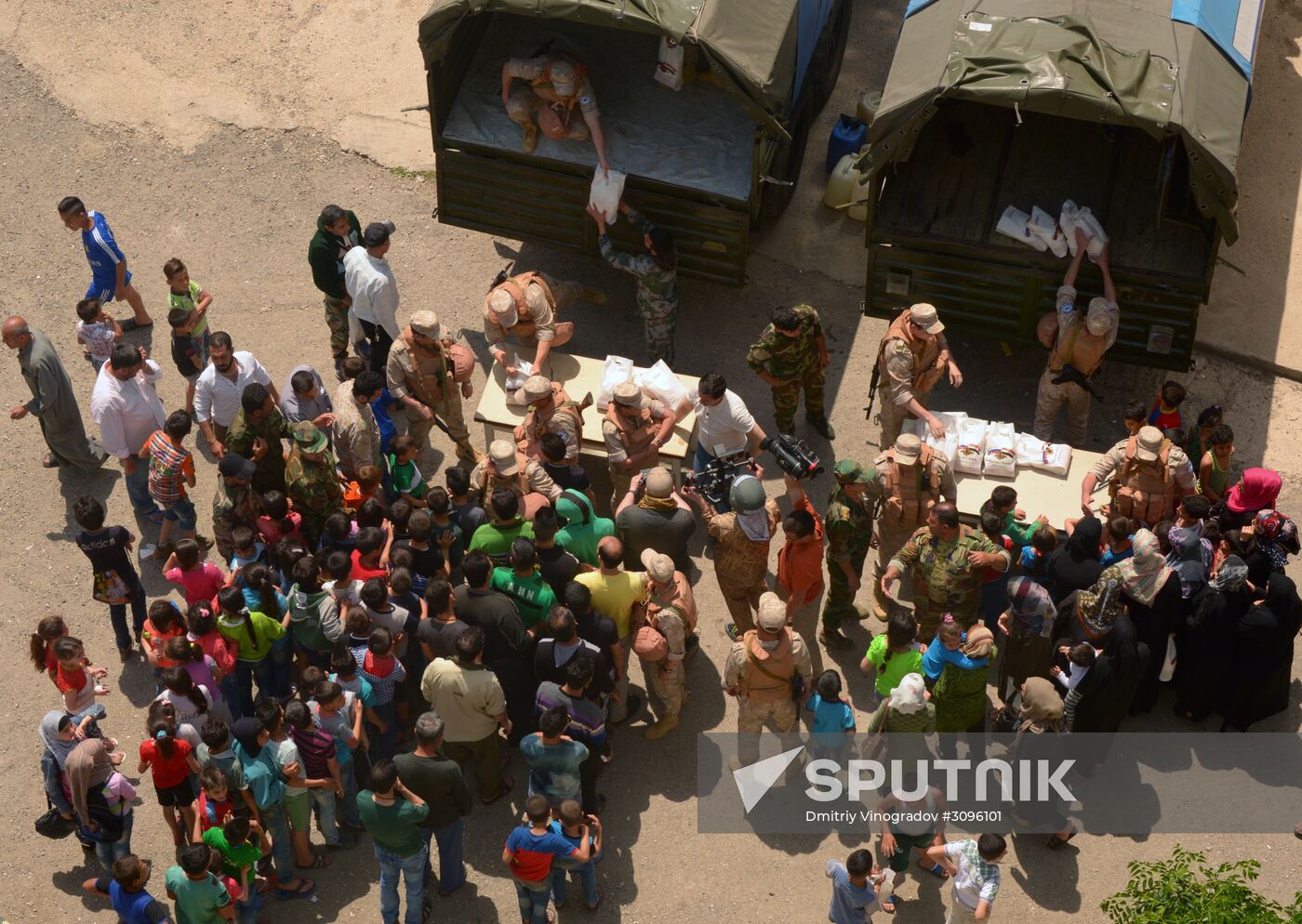 Russian humanitarian aid is distributed at Ras al-Bassit refugee camp