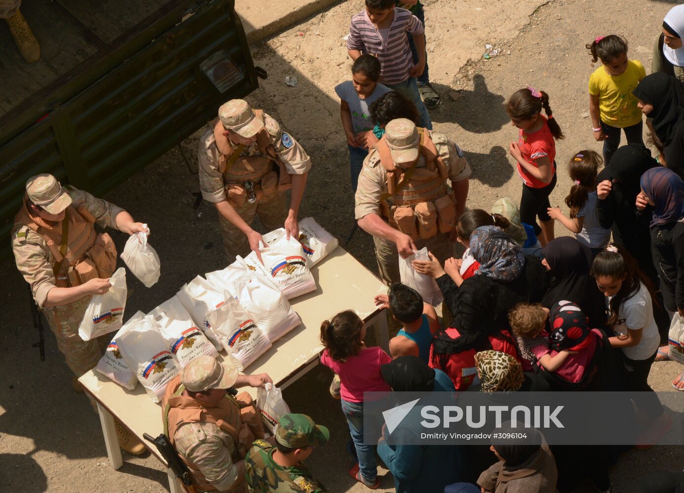 Russian humanitarian aid is distributed at Ras al-Bassit refugee camp
