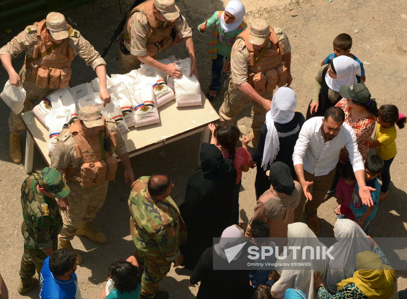 Russian humanitarian aid is distributed at Ras al-Bassit refugee camp