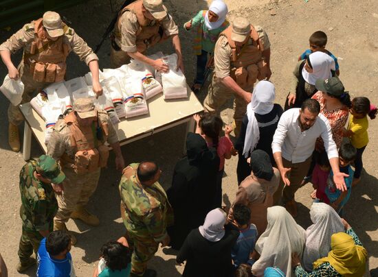 Russian humanitarian aid is distributed at Ras al-Bassit refugee camp