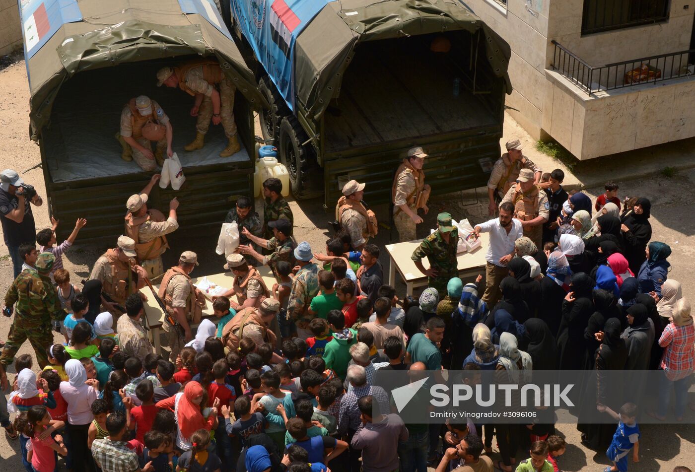 Russian humanitarian aid is distributed at Ras al-Bassit refugee camp