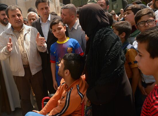 Russian humanitarian aid is distributed at Ras al-Bassit refugee camp