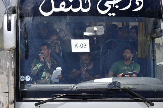 Militants and their families leave Damascus