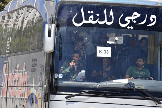 Militants and their families leave Damascus