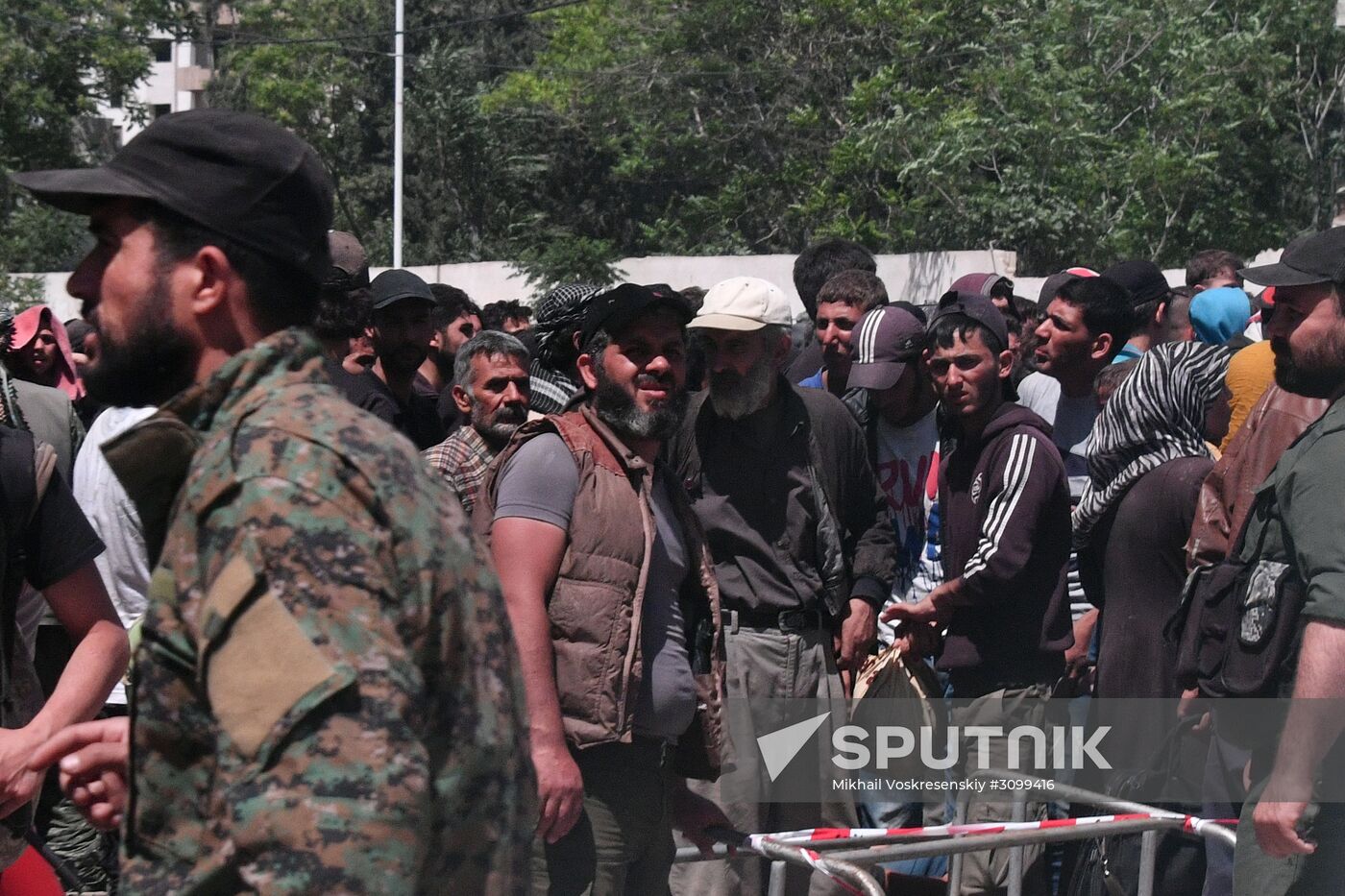 Militants and their families leave Damascus