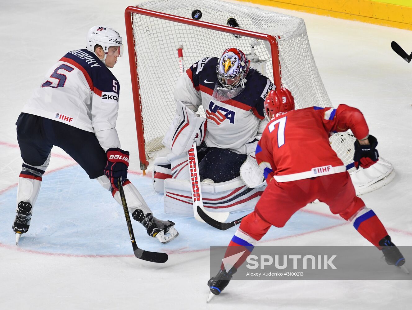 US goalie Jimmy Howard, center, and Russia' player Ivan Telegin at the 2017 IIHF World Championship group stage match between the national teams of Russia and the USA. Location: Germany, Cologne . Author: Alexey Kudenko/Sputnik. 2017 IIHF World Championship. Russia vs USA