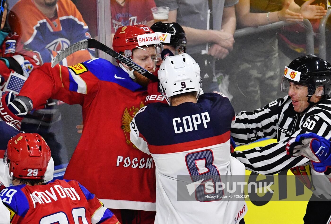 Russia's player Anton Belov, left, and US player Andrew Copp at the 2017 IIHF World Championship group stage match between the national teams of Russia and the USA. Location: Germany, Cologne . Author: Alexey Kudenko/Sputnik. 2017 IIHF World Championship. Russia vs USA