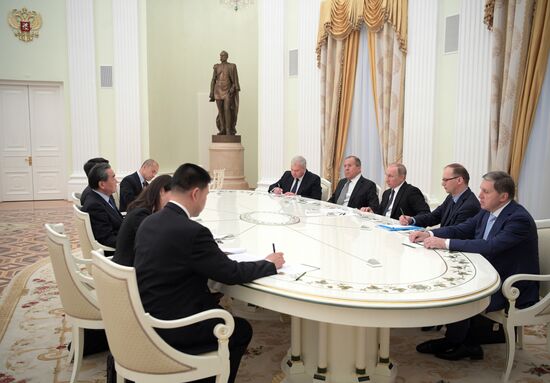 Russian President Vladimir Putin meets with Chinese Foreign Minister Wang Yi