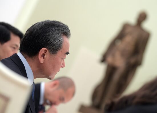 Russian President Vladimir Putin meets with Chinese Foreign Minister Wang Yi