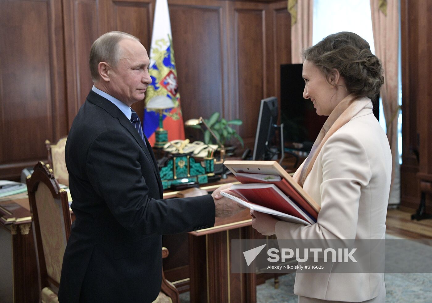 President Vladimir Putin meets with Children's Rights Commissioner Anna Kuznetsova