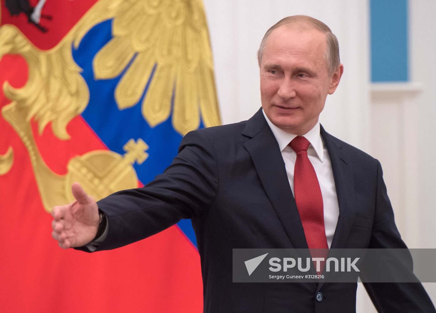 Russian President Vladimir Putin presents passports to young Russian citizens on Russia Day