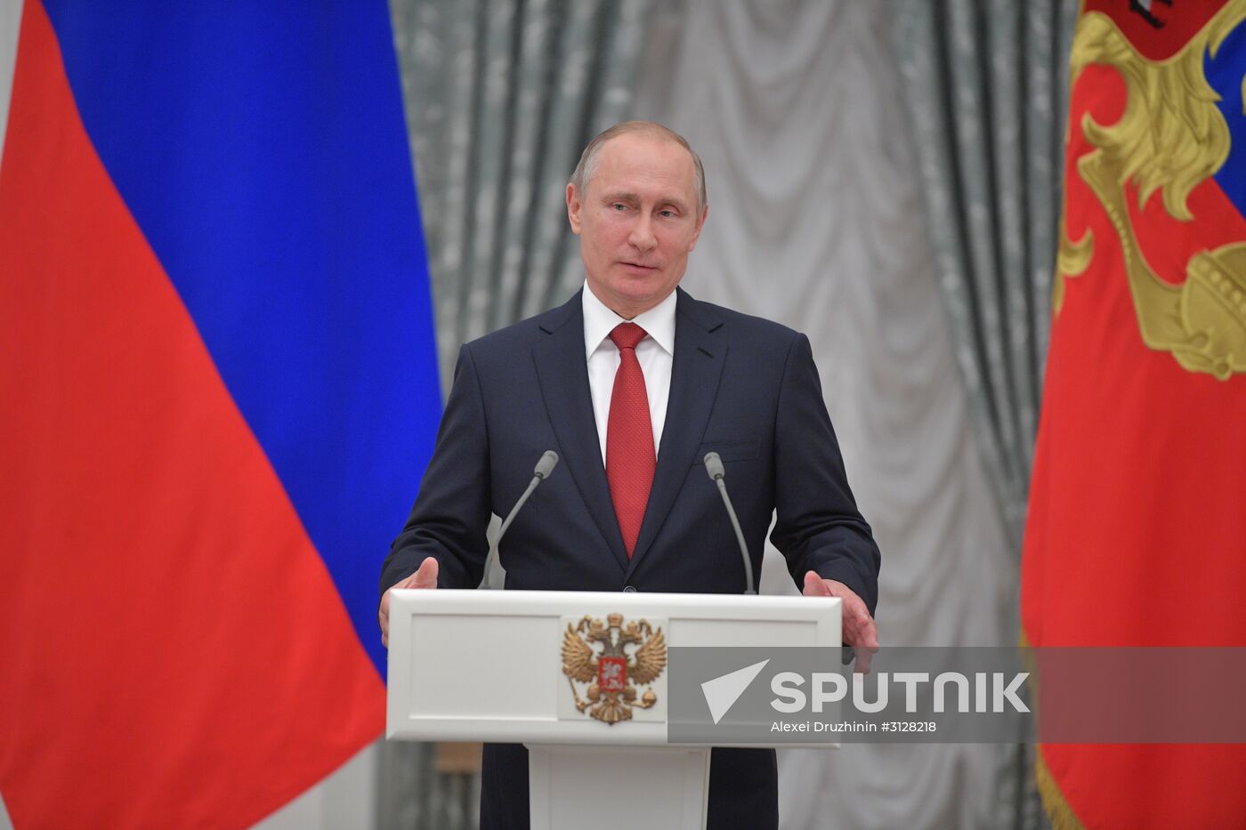 Russian President Vladimir Putin presents passports to young Russian citizens on Russia Day