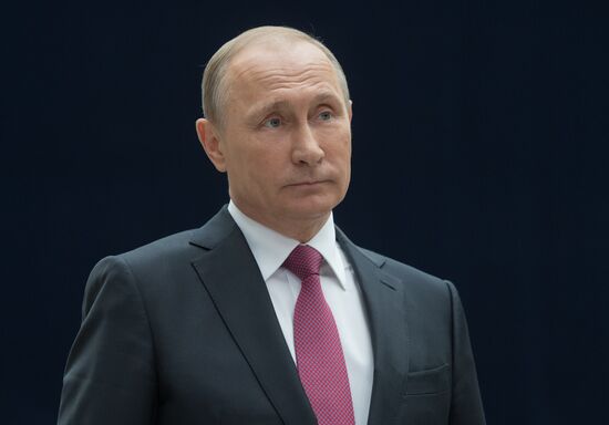Russian President Vladimir Putin answers journalists' questions