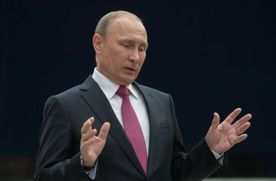 Russian President Vladimir Putin answers journalists' questions