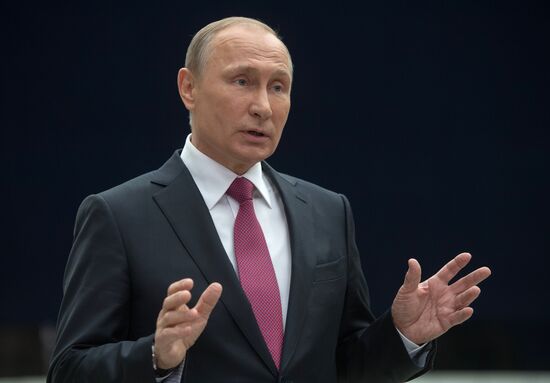 Russian President Vladimir Putin answers journalists' questions