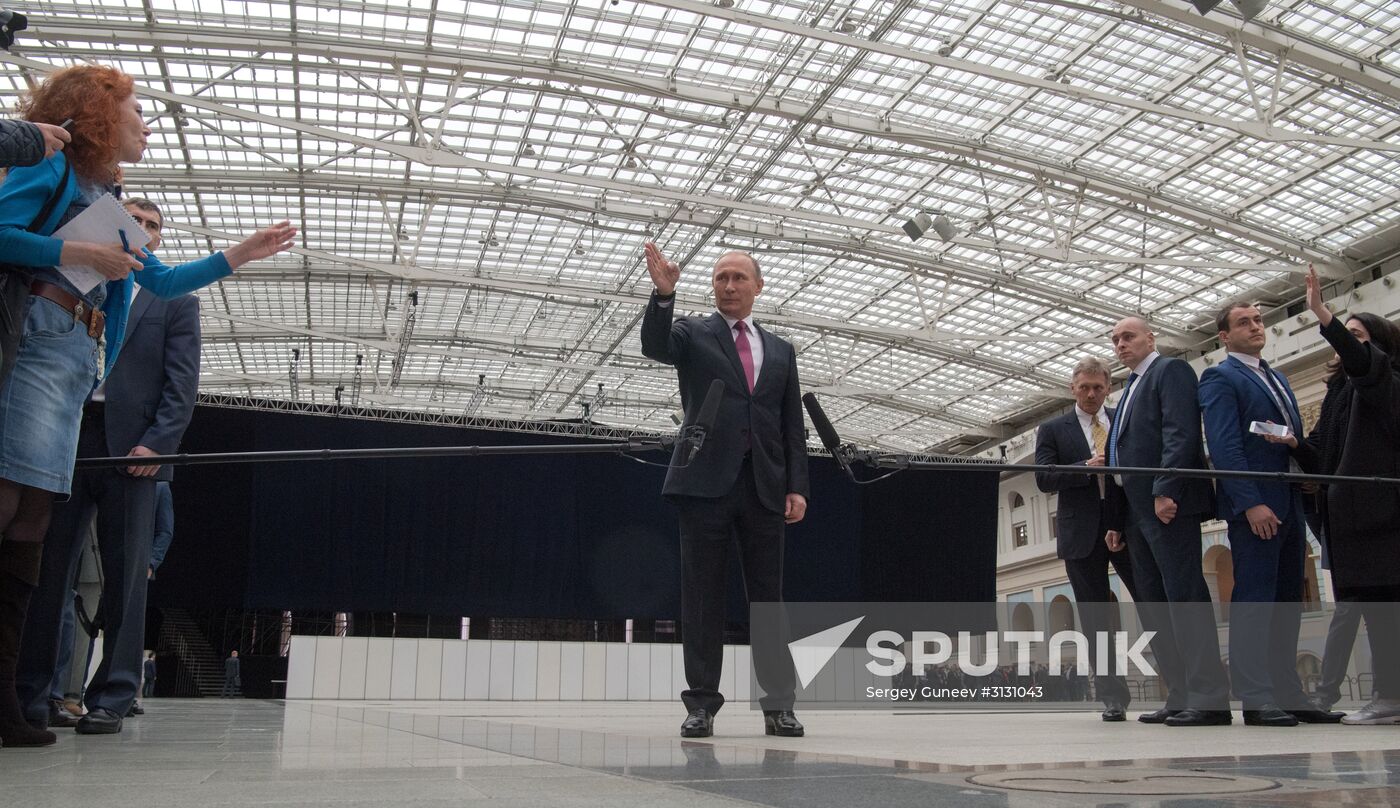 Russian President Vladimir Putin answers journalists' questions