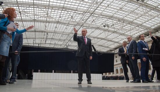 Russian President Vladimir Putin answers journalists' questions