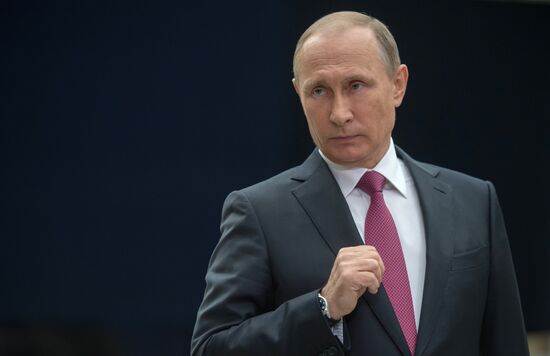 Russian President Vladimir Putin answers journalists' questions