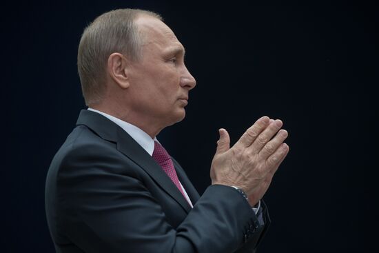 Russian President Vladimir Putin answers journalists' questions