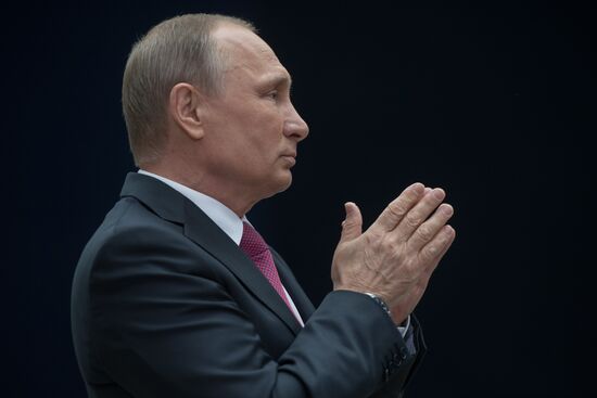 Russian President Vladimir Putin answers journalists' questions