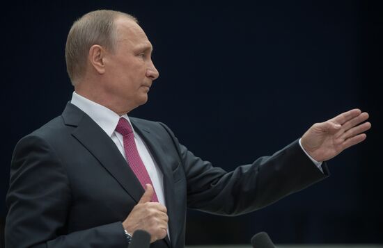 Russian President Vladimir Putin answers journalists' questions