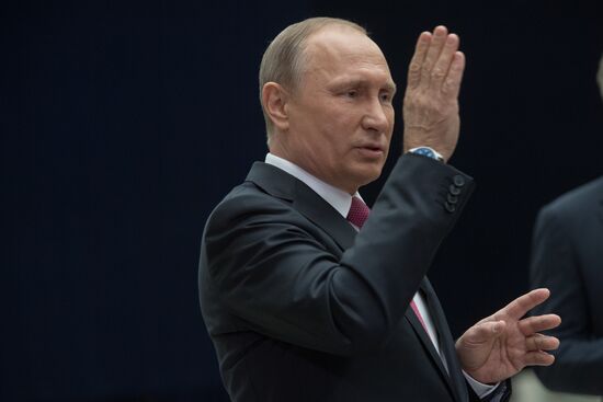 Russian President Vladimir Putin answers journalists' questions