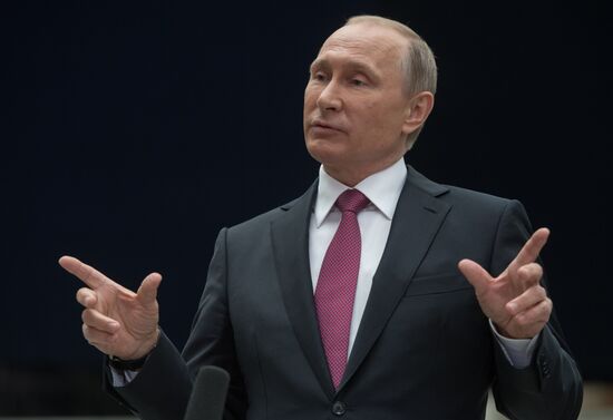 Russian President Vladimir Putin answers journalists' questions