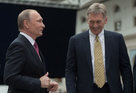 Russian President Vladimir Putin answers journalists' questions