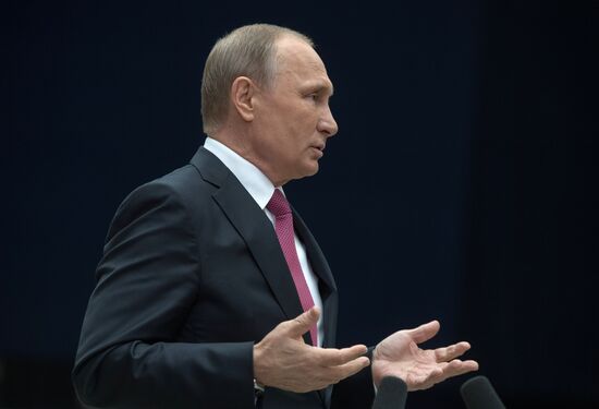 Russian President Vladimir Putin answers journalists' questions
