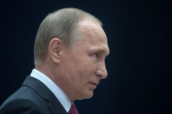 Russian President Vladimir Putin answers journalists' questions