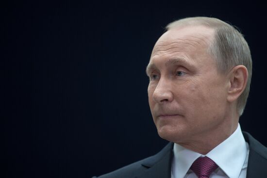 Russian President Vladimir Putin answers journalists' questions