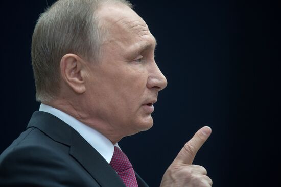 Russian President Vladimir Putin answers journalists' questions