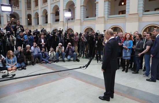 Russian President Vladimir Putin answers journalists' questions