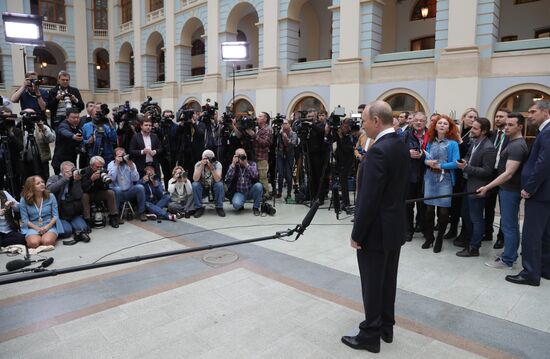 Russian President Vladimir Putin answers journalists' questions