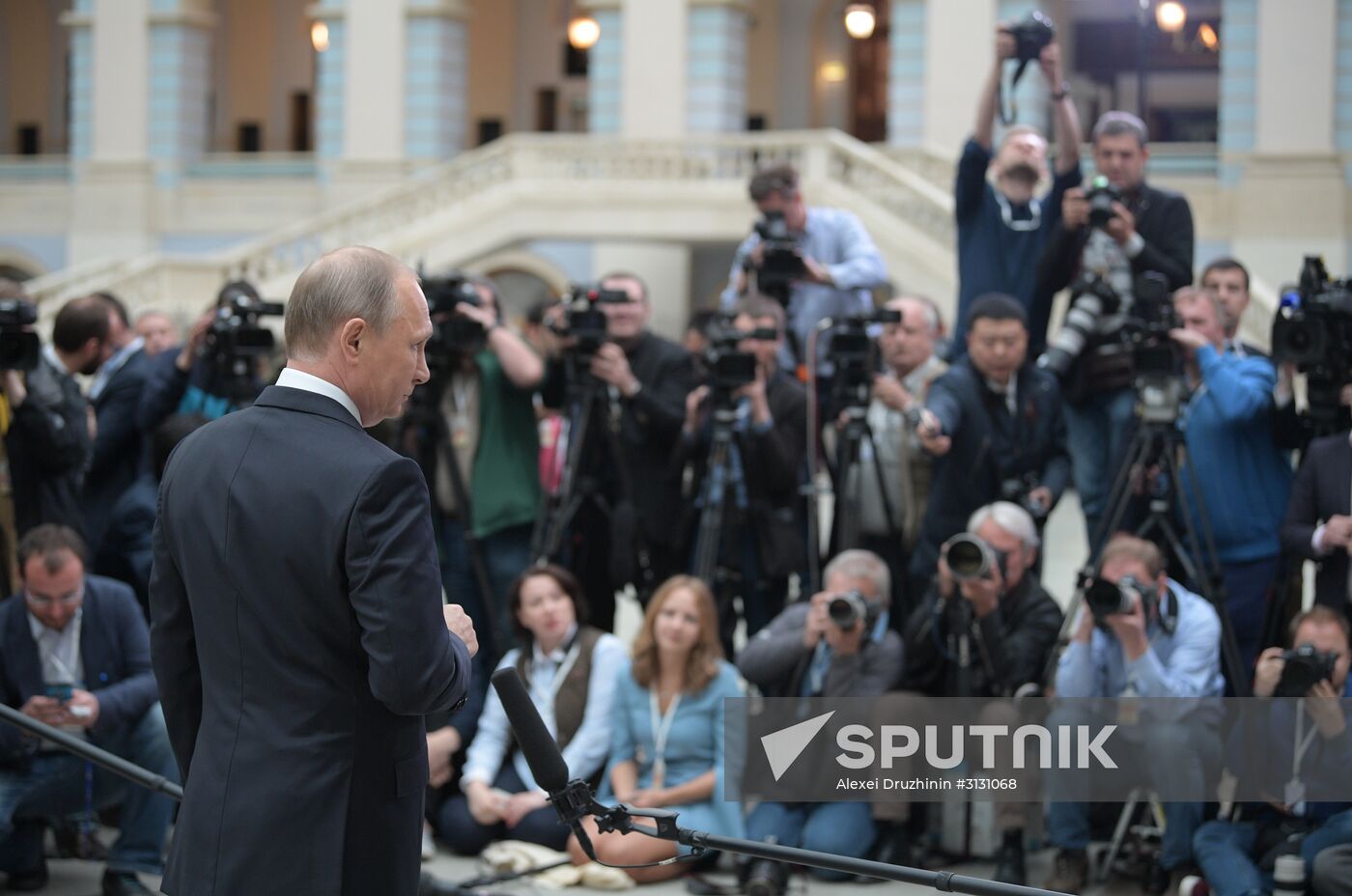 Russian President Vladimir Putin answers journalists' questions