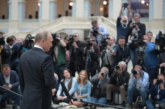 Russian President Vladimir Putin answers journalists' questions