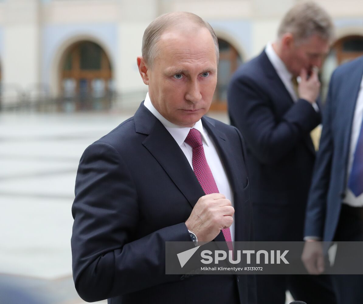 Russian President Vladimir Putin answers journalists' questions