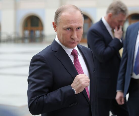 Russian President Vladimir Putin answers journalists' questions