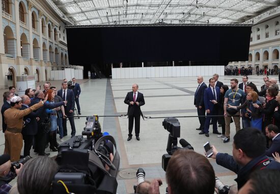 Russian President Vladimir Putin answers journalists' questions