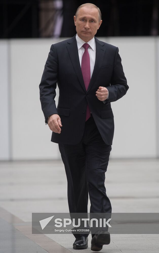 Russian President Vladimir Putin answers journalists' questions