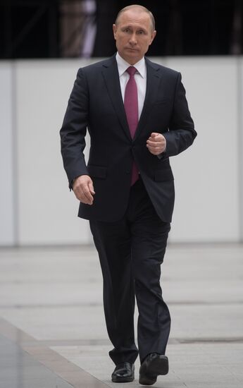 Russian President Vladimir Putin answers journalists' questions