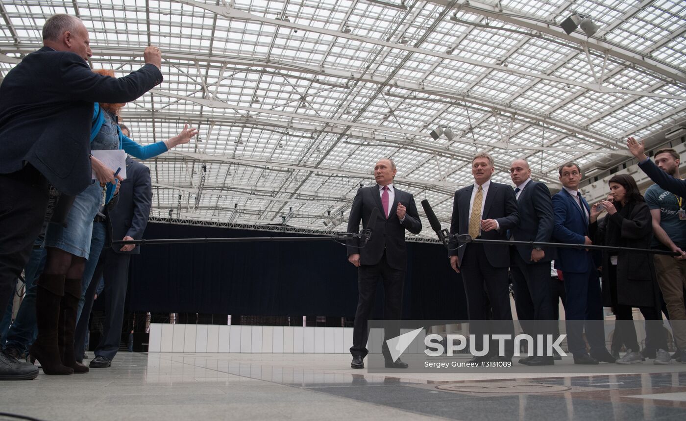 Russian President Vladimir Putin answers journalists' questions