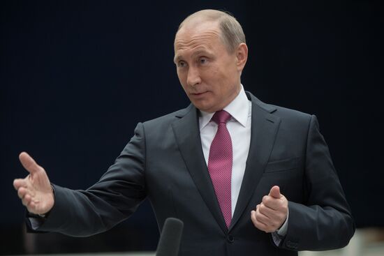 Russian President Vladimir Putin answers journalists' questions
