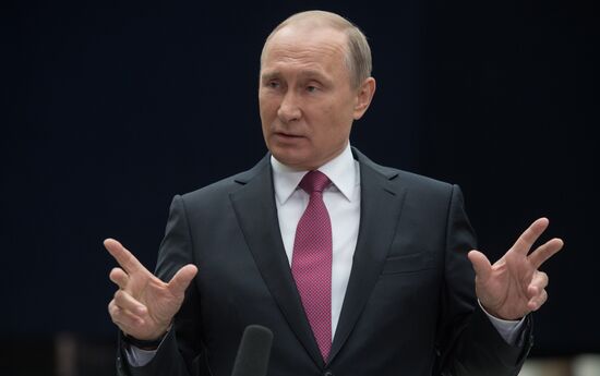 Russian President Vladimir Putin answers journalists' questions