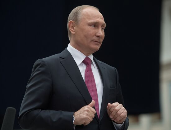 Russian President Vladimir Putin answers journalists' questions