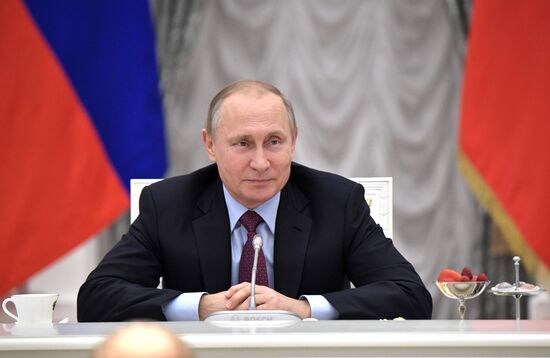 Russian President Vladimir Putin meets with graduating class teachers